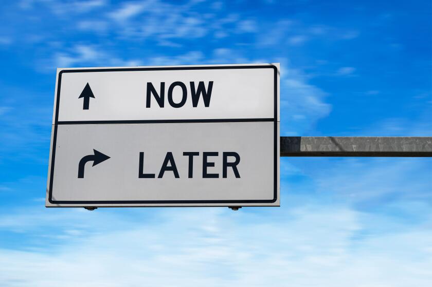 Road sign with words now and later. White two street signs with arrow on metal pole. Directional road, Crossroads Road Sign, Two Arrow. Blue sky backg