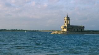 Normanton Church stands by the edge of Rutland Water a reservoir of Anglian Water Rutland England. Image shot 2003. Exact date unknown.