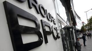 People leave the BPCE bank headquarters in Paris, France, September 24, 2015. A French court on Thursday acquitted BPCE bank Chairman Francois Perol of accusations of having an illegal conflict of interest when he was appointed in 2009 head of France's se