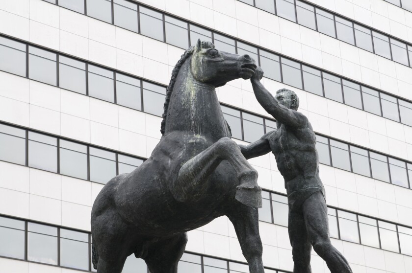 Statue in front of the BCP Millenium bank headquarters in Porto, Portugal