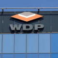 Bucharest, Romania - August 16, 2021: A logo of WDP, Warehouses De Pauw, Belgium logistics for warehouse rentals company, is displayed on the top of a