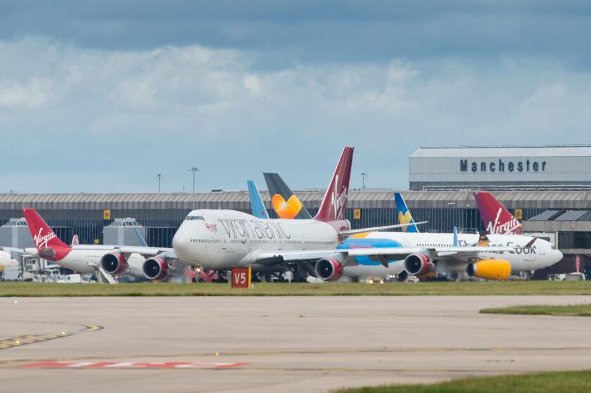 A general view of Manchester Airport runway including a Virgin Atlantic Boeing 747 in the foreground.