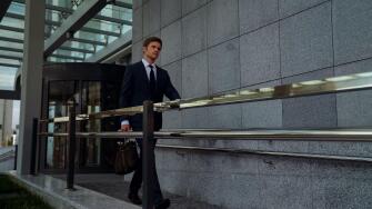 Ambitious businessman leaving office center after successful meeting, routine