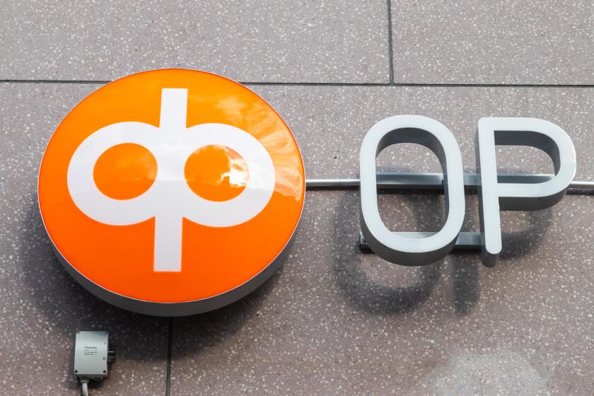 Kouvola, Finland - 22 September, 2019: OP-Pohjola Group bank sign on the wall of bank office.