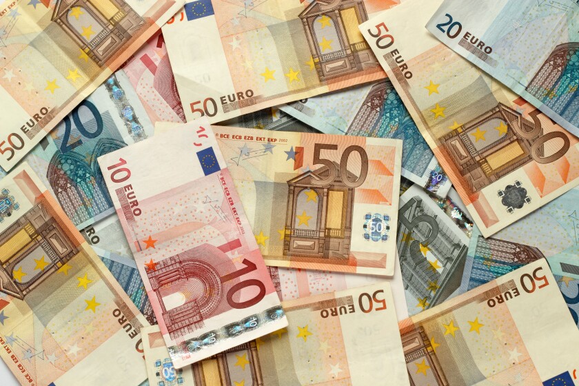 Lots of various Euro cash notes covering the photo.