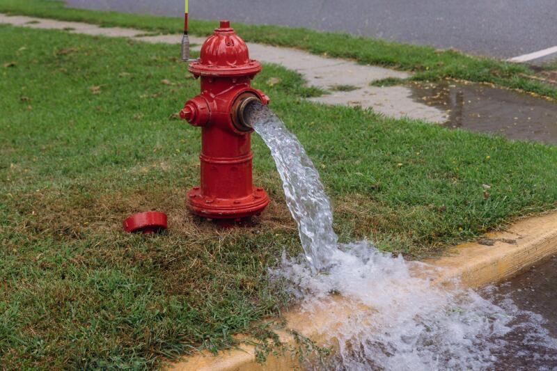 Open in industrial fire hydrant being sprayed strong water