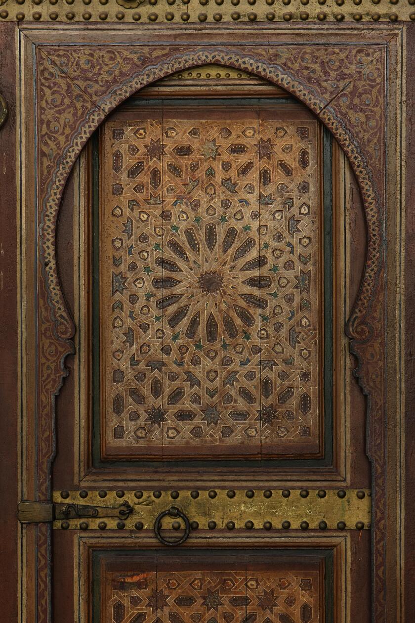 Islamic art.Typical wooden Moroccan door in a religious building.Marrakesh,Morocco,Africa