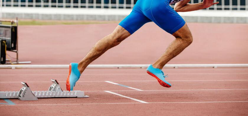 male runner start sprint running with starting blocks