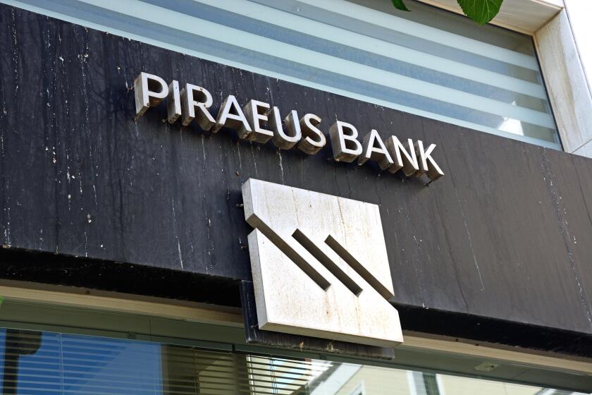 Greek Piraeus Bank building along 25is Avgoustou, Heraklion, Crete, Greece, Europe.