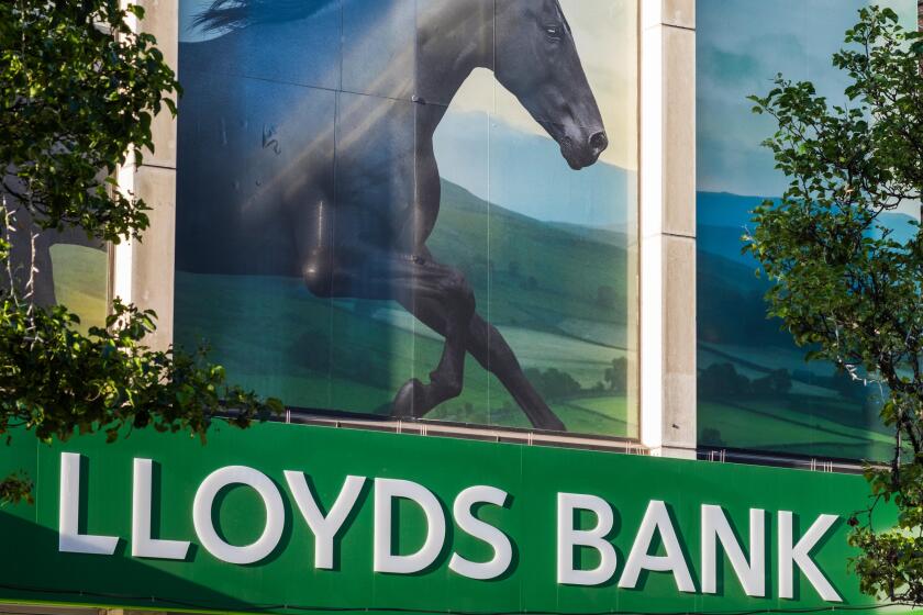 Lloyds bank with picture of black horse above the branch on Oxford street, London, England, U.K.