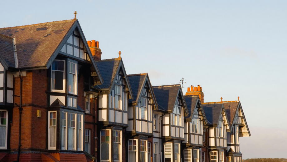 A row of large Edwardian style house rooftops in early morning sun at Scarborough