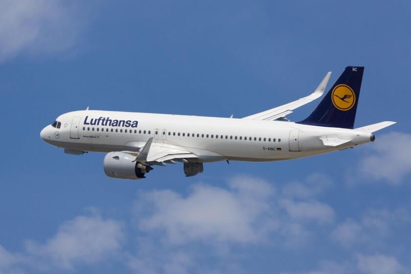 Barcelona, Spain - May 16, 2021: Lufthansa Airbus A320neo banking left after taking off from El Prat Airport in Barcelona, Spain.