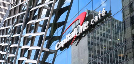 Logo of Capital One on the modern facade of a building.