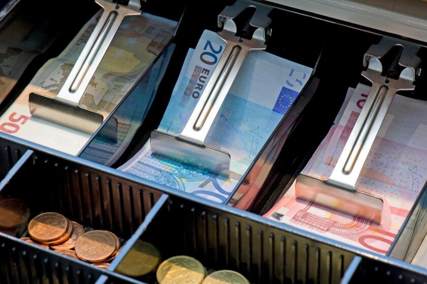 Euro bank notes and coins in a cash register, Stuttgart, Baden-Wuerttemberg