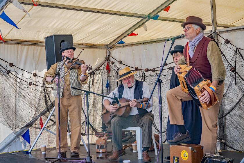 Great Yarmouth, Norfolk, UK ? September 08 2019. A folk band made up of one lady and three men during a performance at the Great Yarmouth Maritime Fes