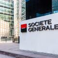 Sign of the Societe Generale at the entrance of the head office of the french banking group in La Defense business district.