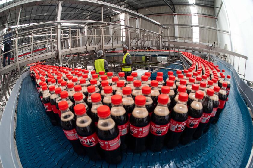 220531 -- SEBETA, May 31, 2022 -- Employees work inside the Coca-Cola bottling plant in Sebeta town of Oromia regional state, Ethiopia, on May 31, 2022. The Coca-Cola Beverages Africa CCBA on Tuesday inaugurated its new 100 million U.S. dollars Coca-Cola 