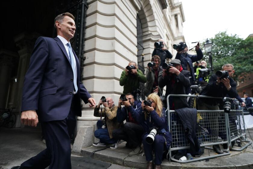 Jeremy Hunt arrives in Downing Street in London after he was appointed Chancellor of the Exchequer following the resignation of Kwasi Kwarteng. Picture date: Friday October 14, 2022.
