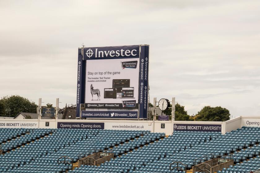 The Electronic video replay board at Headingley Cricket Ground, Leeds, showing advertising images and Investec - the sponsors.