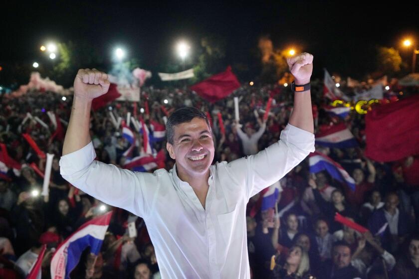 Santiago Pena, presidential candidate of the Colorado party cheers during a political rally at Asuncion, Paraguay, Tuesday, April 18, 2023. Paraguay´s general elections are scheduled for April 30th. (AP Photo/Jorge Saenz)