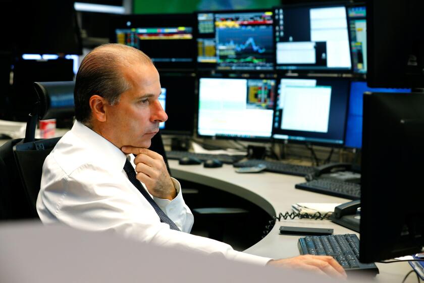 A trader works during the initial public offering (IPO) of German defense supplier Hensoldt AG at the Frankfurt Stock Exchange in Frankfurt, Germany, September 25, 2020. REUTERS/Ralph Orlowski