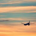 Airplane taking off in the sunset