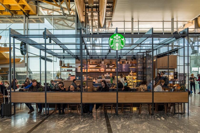 Oslo, Norway - Mar 28 2018 : Starbucks coffee with customers relaxation of located branch inside at Oslo international airport