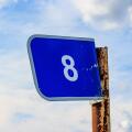 Kilometer blue sign on a pole with the number eight
