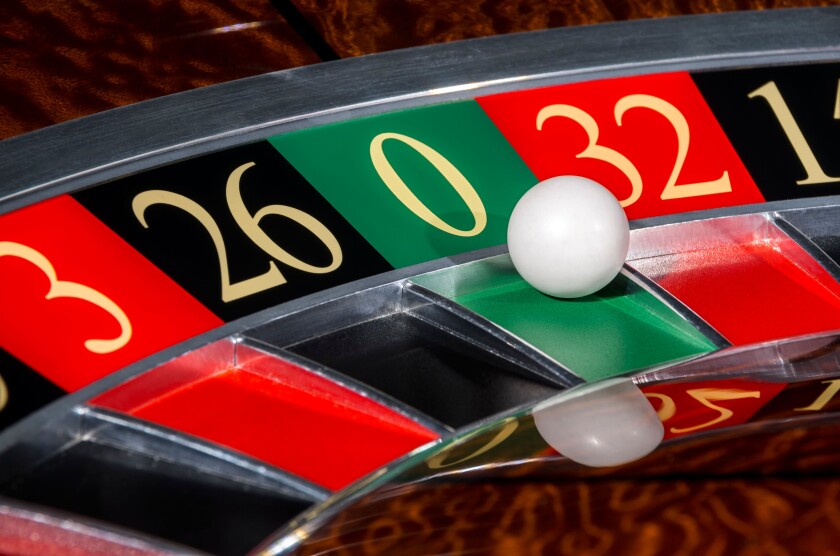 Classic casino roulette wheel with sector zero and white ball