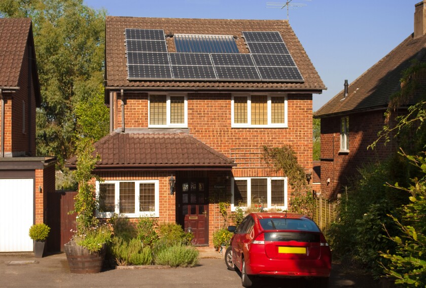 Solar panels on house roof with regenerative energy system