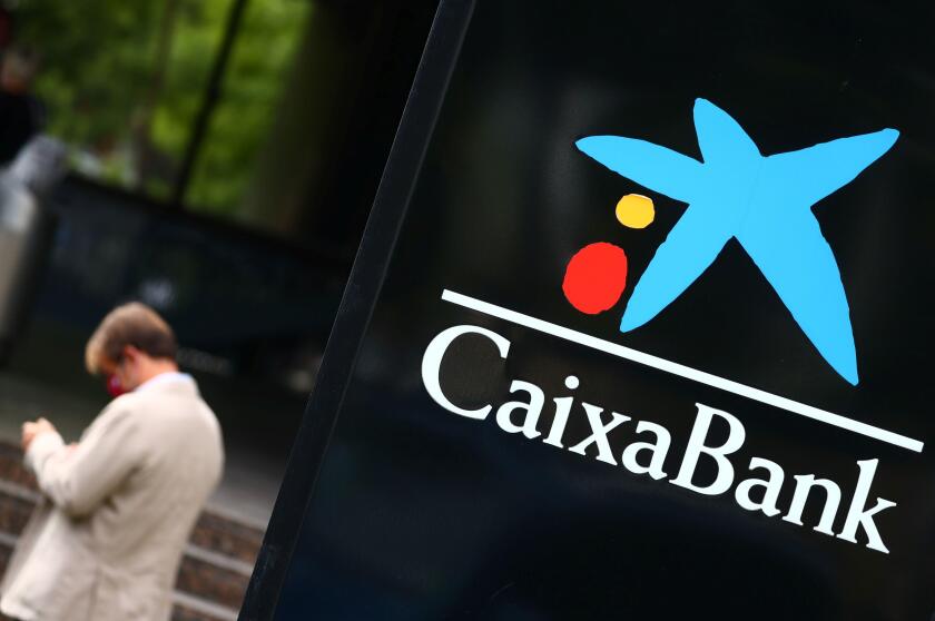 The logo of Caixabank is seen outside a branch in Madrid, Spain, September 16, 2020. REUTERS/Sergio Perez