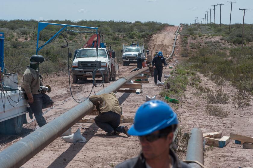 VACA MUERTA, ARGENTINA - Nov 05, 2015: A gas pipeline construction process in Vaca Muerta, Neuquen, Argentina.