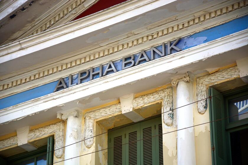 Greek Alpha Bank building along 25is Avgoustou, Heraklion, Crete, Greece, Europe.