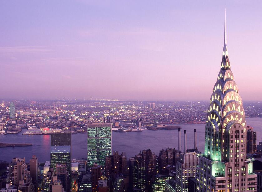 Chrysler Building illuminated evening sky. United Nations Building Commercial real estate The East River New York City skyline from above, Midtown USA