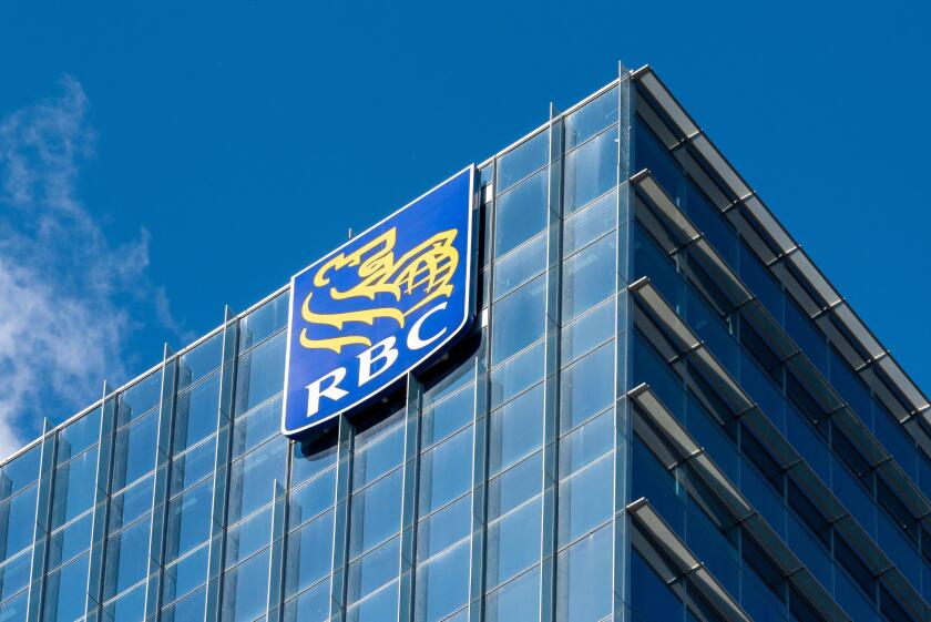 Business logo or sign of the Royal Bank of Canada (RBC) in a skyscraper by the city waterfront in Toronto, Canada