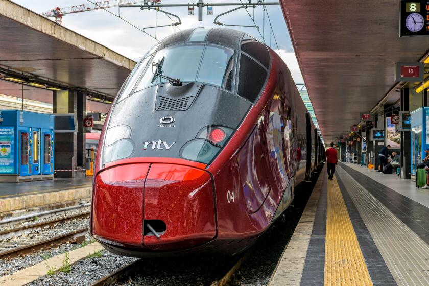 Red High-Speed Train - Front view of a red modern high-speed electric train, Alstom AGV 575 of NTV, parking in Rome Termini Train Station. Rome, Italy.