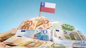 The national flag of Chile sticking in a pile of mixed european banknotes.(series)