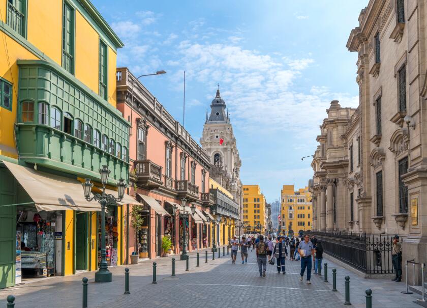Jiron Carabaya looking towards the Plaza de Armas with the Presidential Palace to the right, Centro Historico (historic centre), Lima, Peru