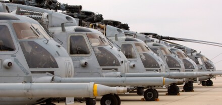 Military Helicopters lined up in a row