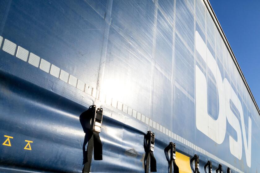 DSV curtain side trailer. DSV A/S is a Danish transport and logistics company offering transport services worldwide by road, air, sea and train.
