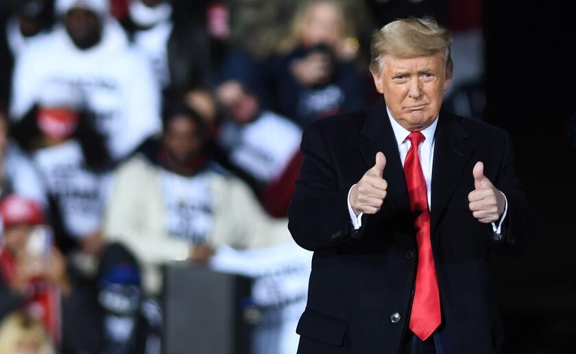 U.S. President Donald Trump gives a thumbs up after speaking at a Republican National Committee Victory Rally in support of incumbent Republican Senate candidates Sen. Kelly Loeffler (R-GA) and Sen. David Perdue (R-GA) at the Dalton Regional Airport.