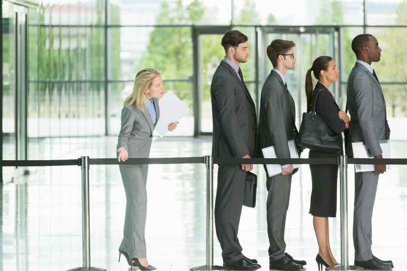 Business people waiting in line