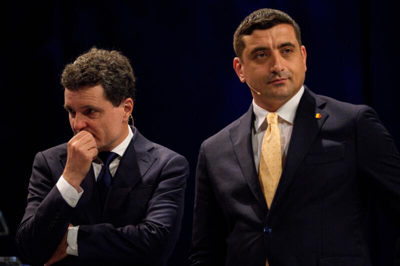 Presidential candidates Nicusor Dan, left, and George Simion during a live electoral debate ahead of the second round of the country's presidential election redo in Bucharest, Romania, Thursday, May 8, 2025. (AP Photo/Andreea Alexandru)