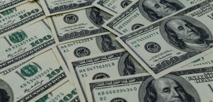 A multitude of laid-out and overlapping US hundred-dollar bills