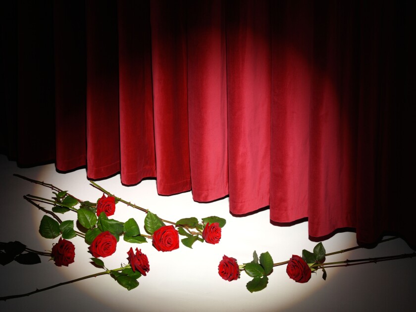 THEATRE CURTAIN CALL WITH RED ROSES