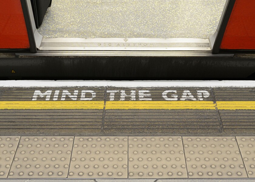 Mind the Gap Warning Sign on the Platform Edge of a London Underground Station.