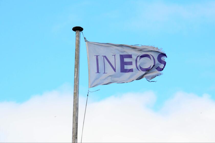 The company flag flies over the Ineos Grangemouth headquarters on the day the company announced the closure of the petrochemical plant