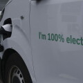 An electric van charges at a Moto service station on the M5 motorway, Exeter, UK