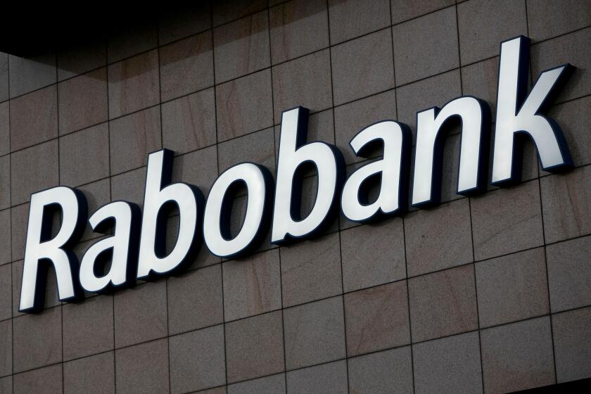 A logo sign outside of an office building occupied by Rabobank in Amsterdam, Netherlands on October 2, 2015