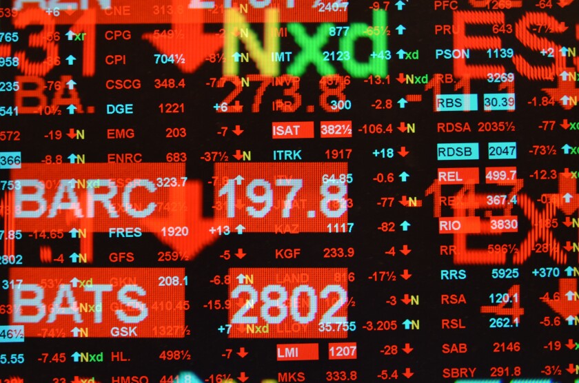 Multiple exposure of FTSE 100 main constituents screen for trading stocks and shares showing down day decreasing prices